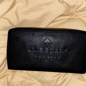 A Kate spade wallet (larchmont avenue logo)